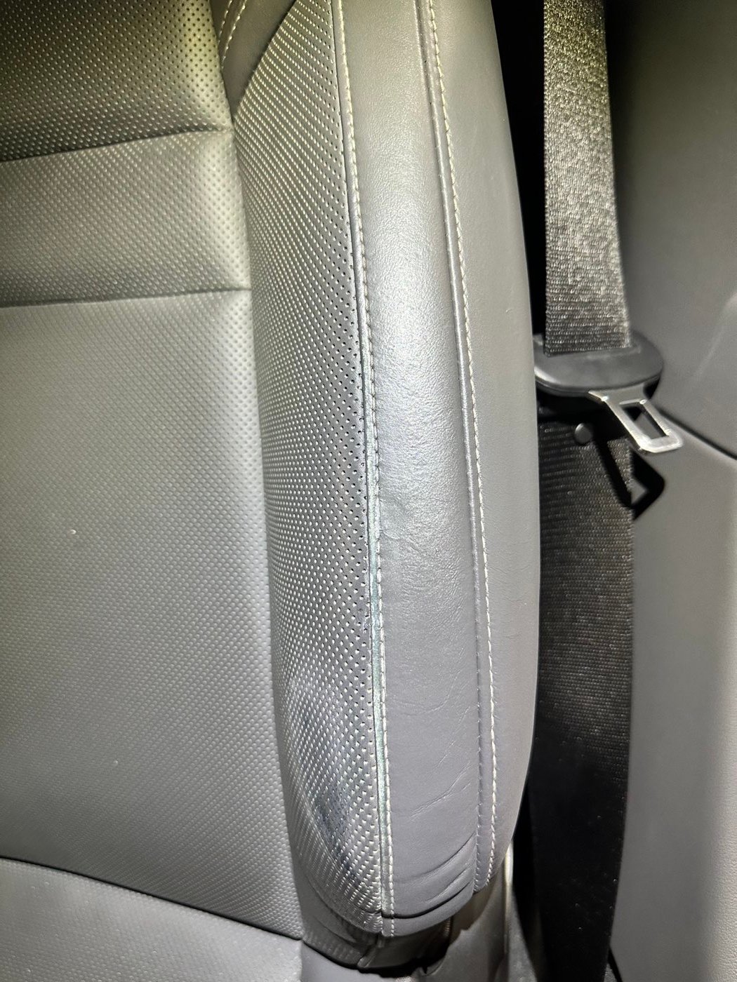 Grey leather bolster before conditioning