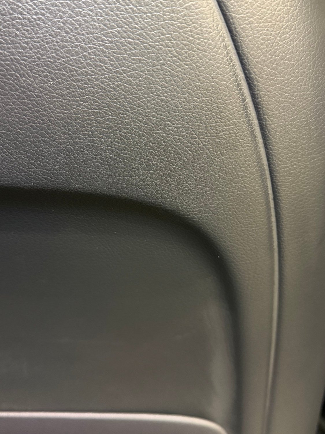 Black leather rear seat after leather restoration