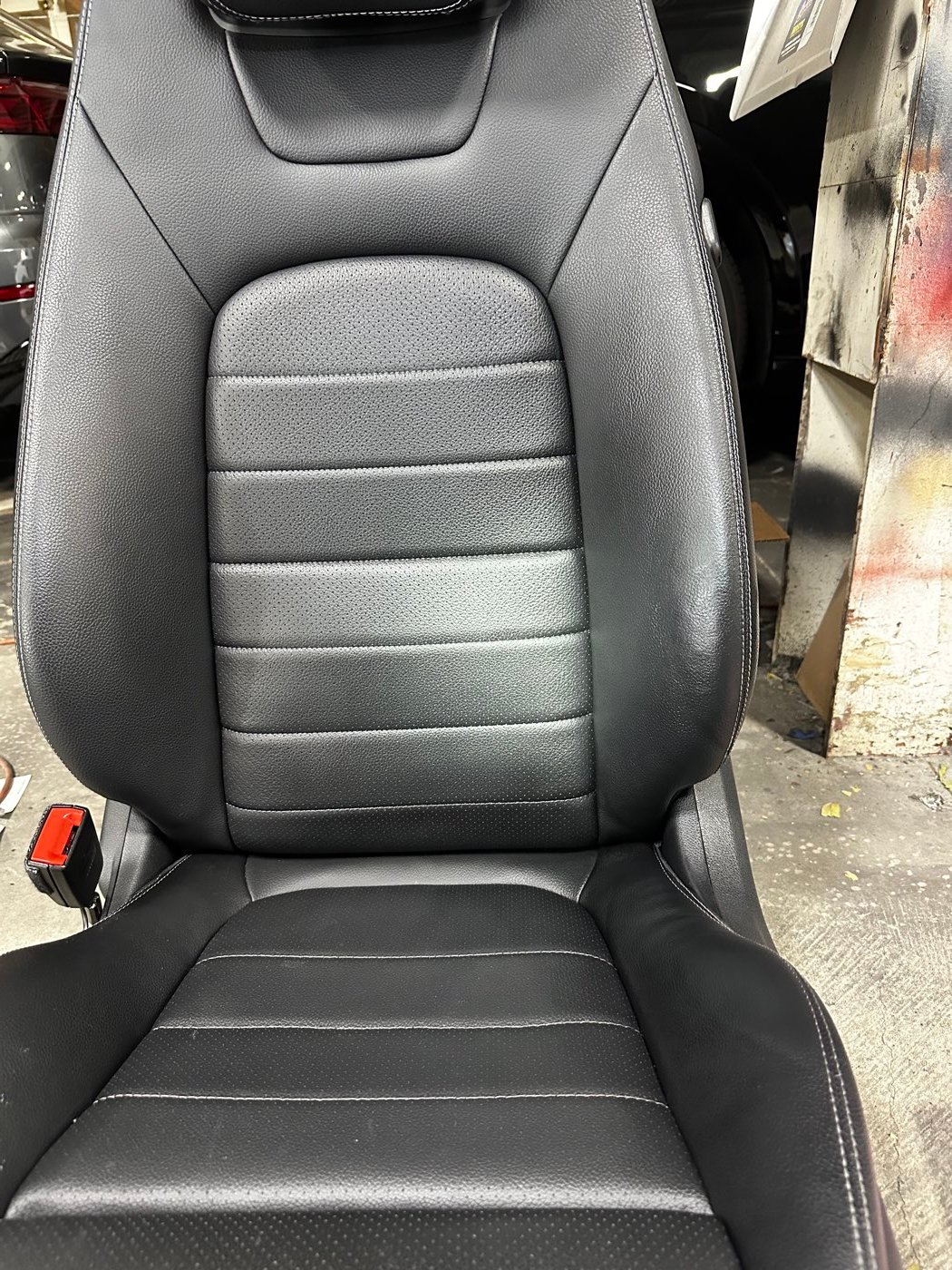 Black leather seat after restoration